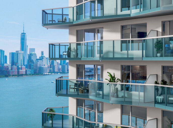 Modern balconies overlooking an urban skyline. The glass balustrades provides an unobstructed view, enhancing the seamless indoor-outdoor transition.